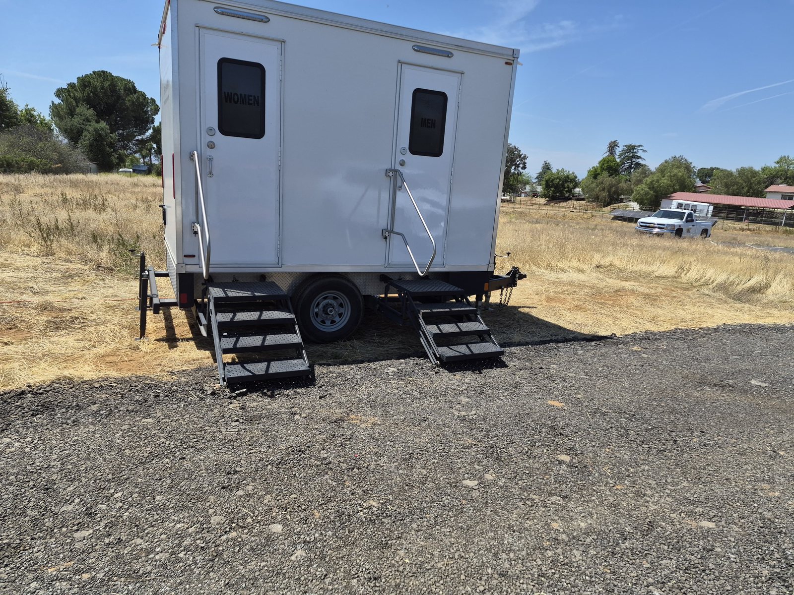 2 station restroom trailer staged at the desert jobsite, an Arizona restroom trailer rental job