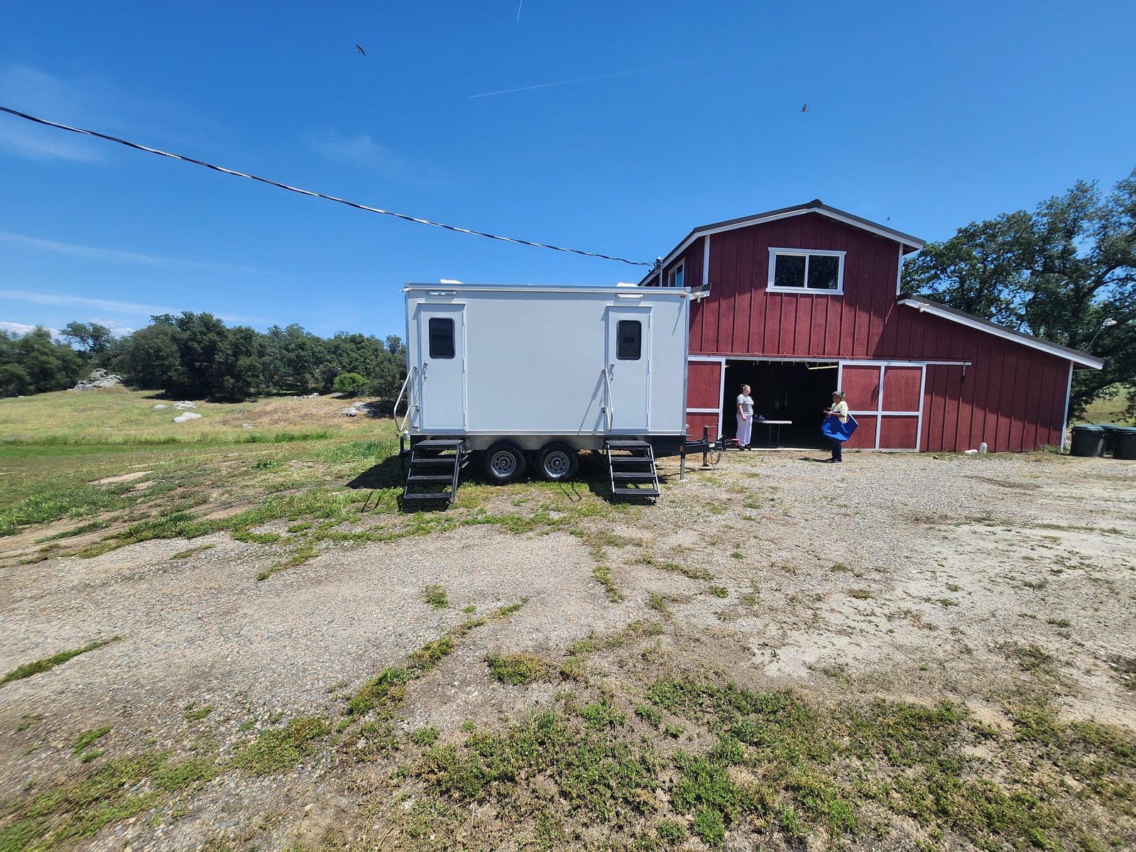 2 station restroom trailer staged at the rural barn, an Arizona restroom trailer rental job