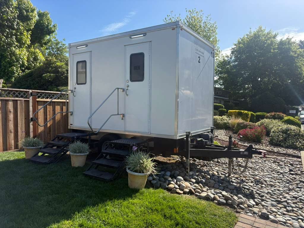 2 station restroom trailer in the residential backyard (restroom trailer rental, Oregon)