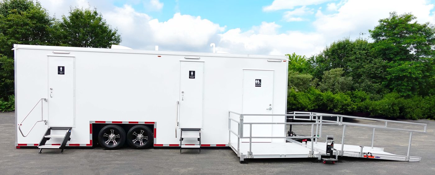 ADA accessible restroom trailer with ramp system installed