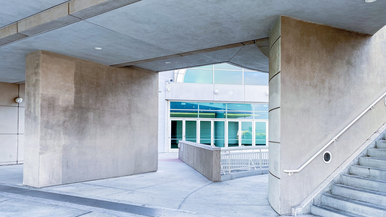 A modern concrete office building entrance