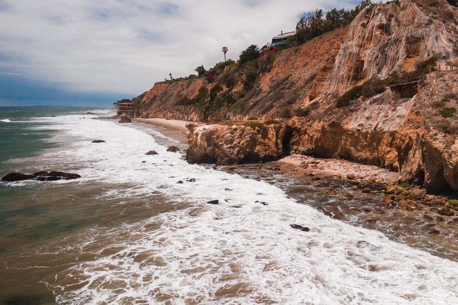 Coastal bluffs and surf along the Pacific shore