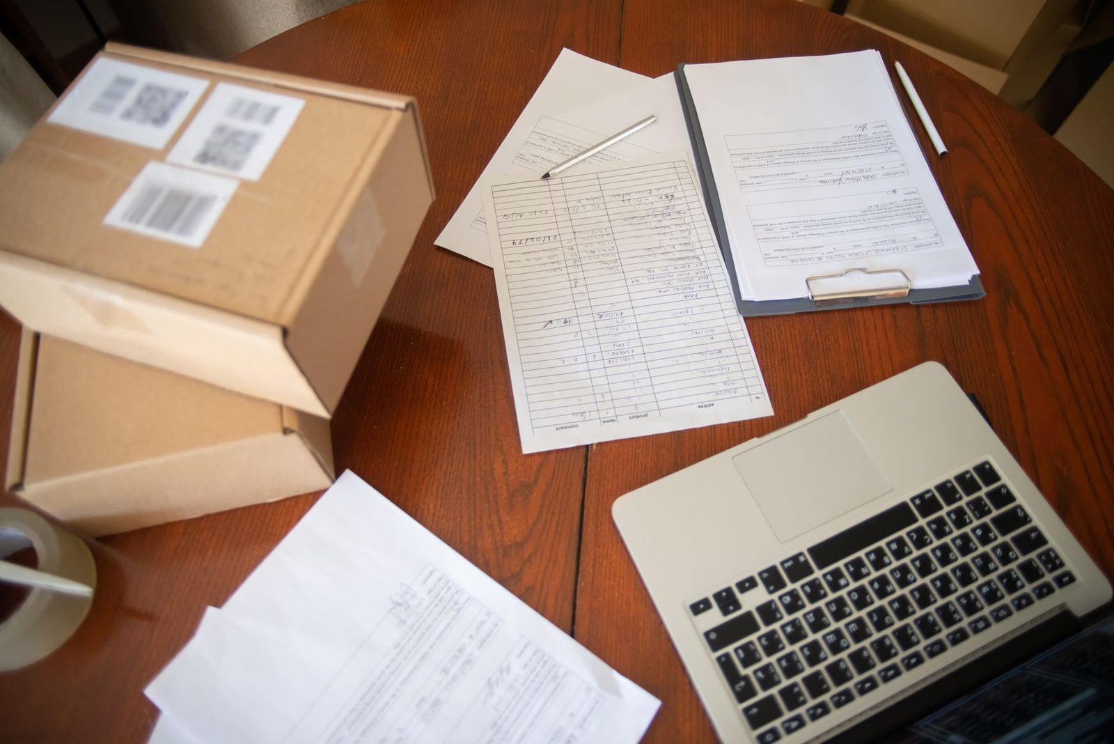 Paperwork and a laptop on a desk