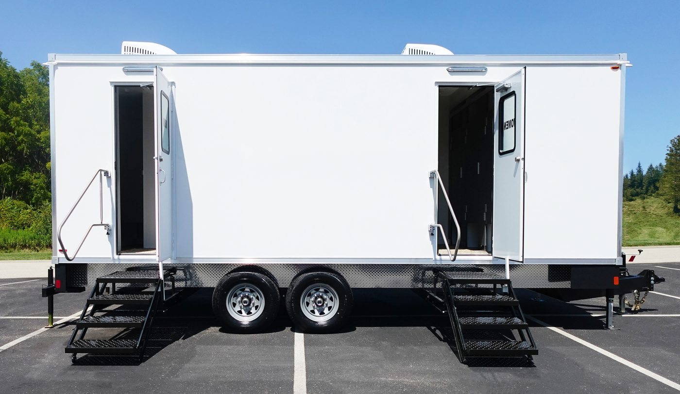 White multi station bathroom trailer with entry steps and open doors