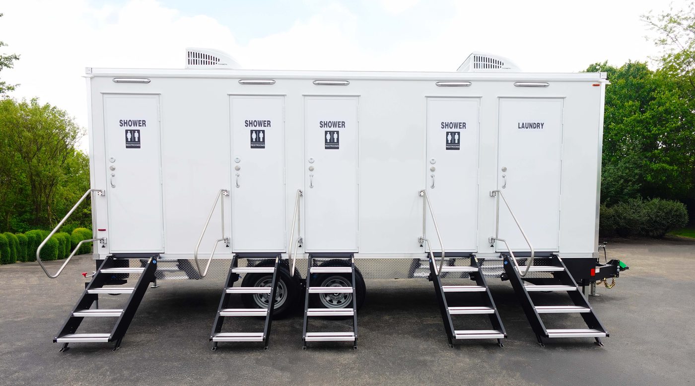 Combination shower restroom and laundry trailer with multiple station doors