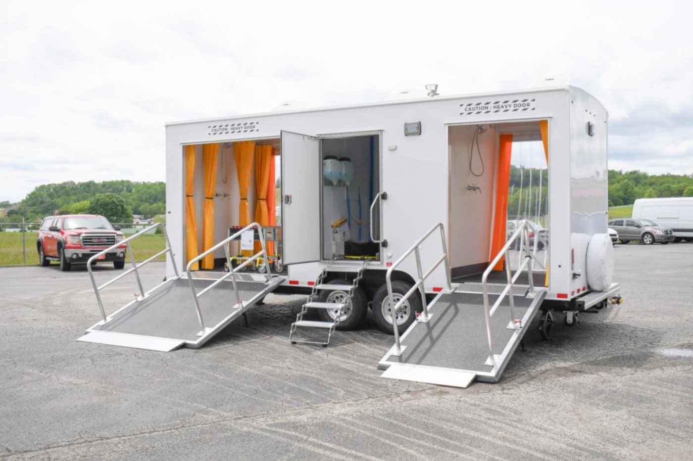 Mavirus Group decontamination unit trailer with dual access ramps, shower stations and containment curtains