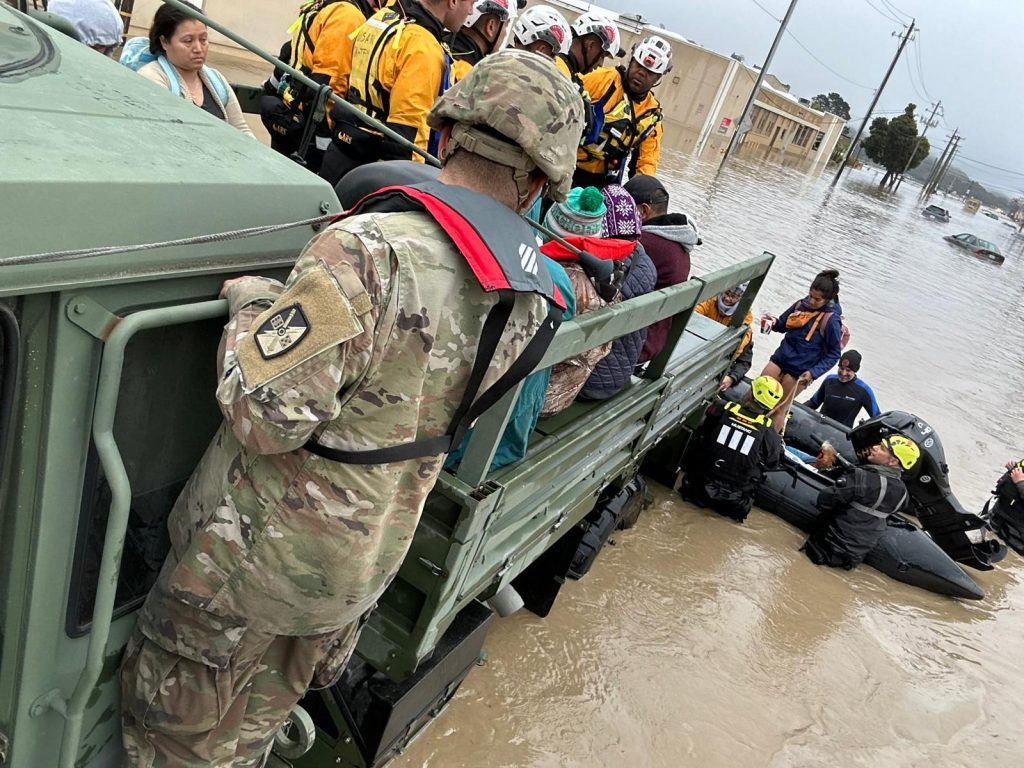 Emergency crews conducting flood rescue operations during a disaster response