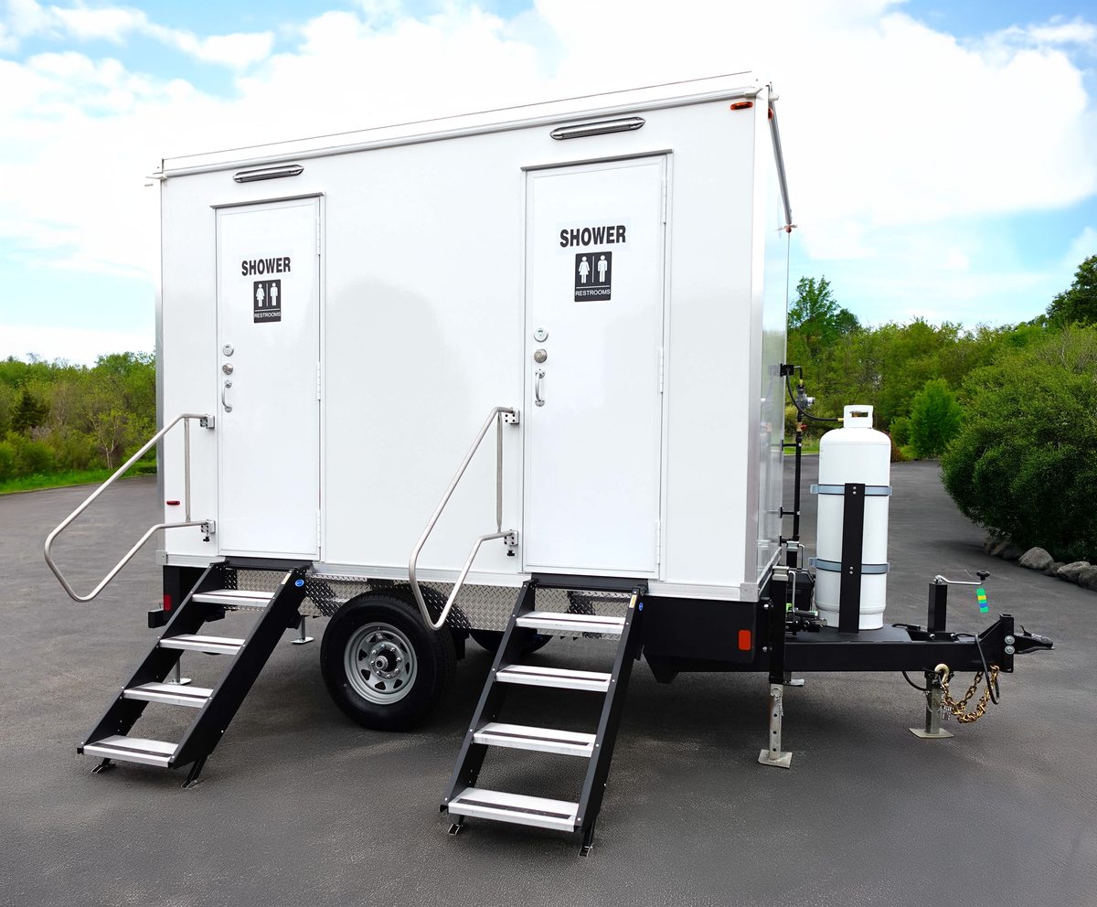 Two suite shower and restroom combo trailer sized for small crew camps and field operations