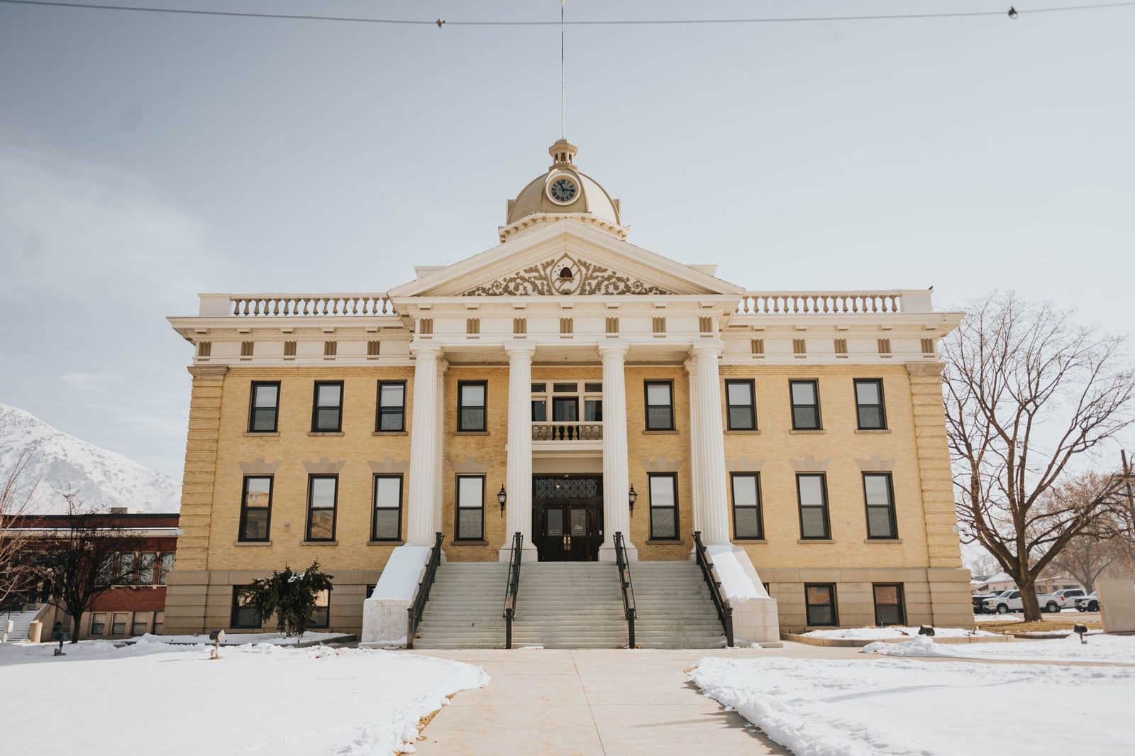 The front of a courthouse building on a clear day