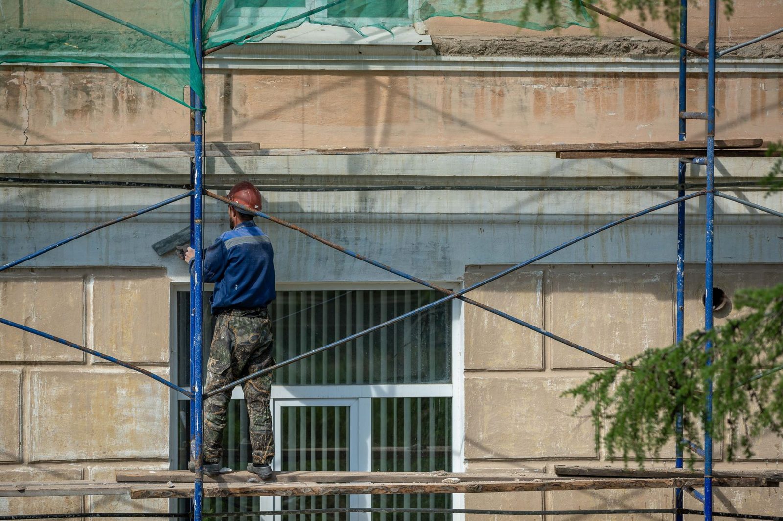 Scaffolding on the side of a large stone public building