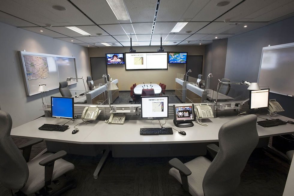 Incident command room in operation with monitors and status displays being worked
