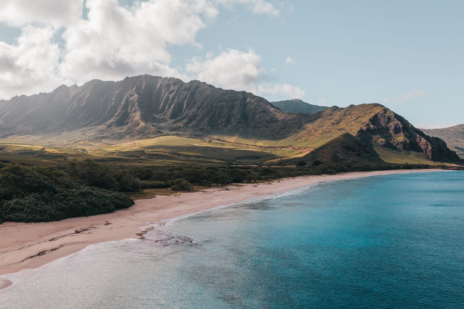 The dry Waianae Range above a quiet leeward Oahu beach