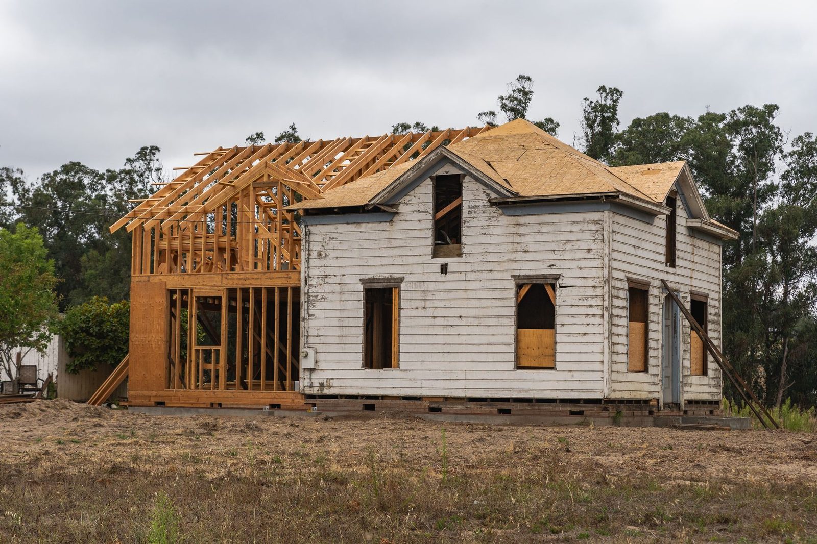 A house being rebuilt with new wood framing