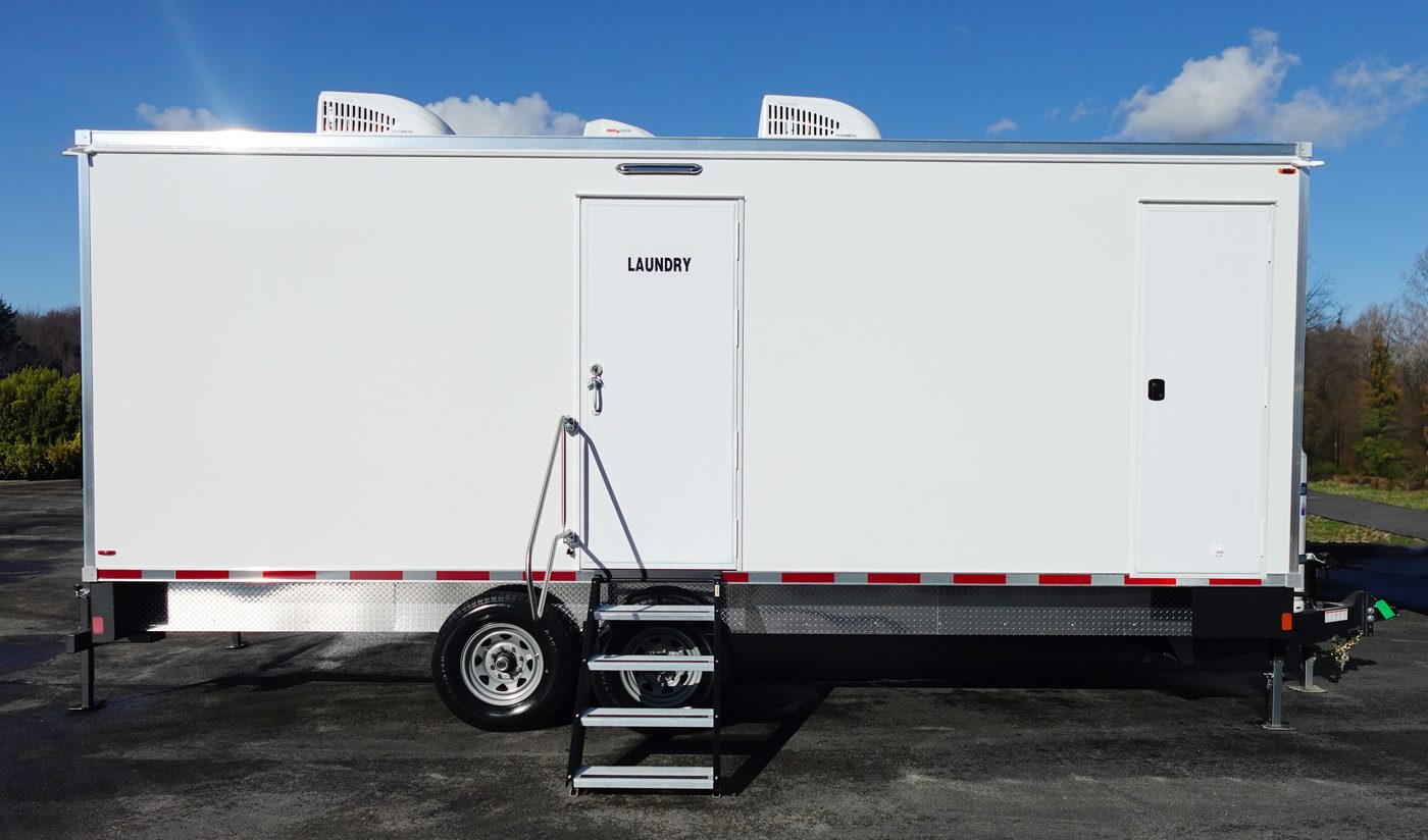 White laundry trailer with exterior utility door and fold out steps