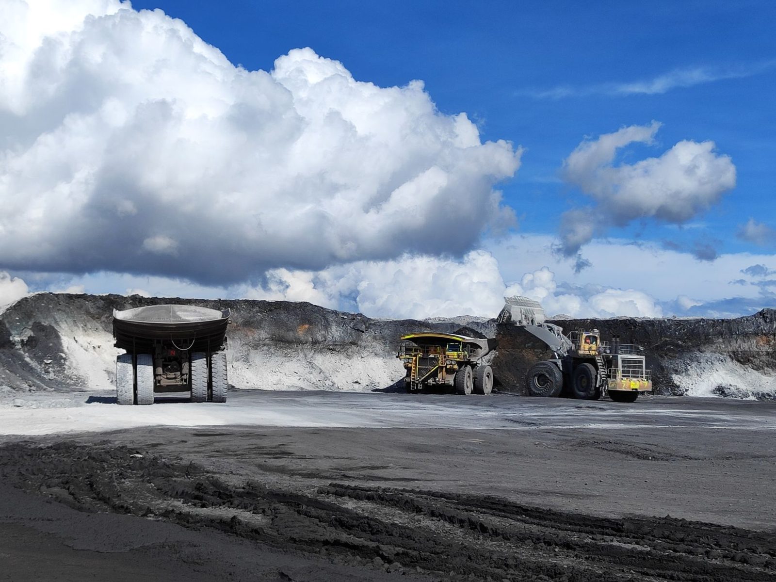 Haul trucks working at an open pit mine