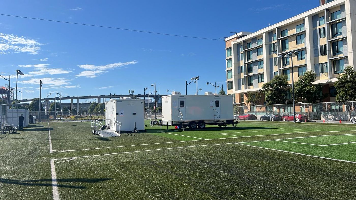 Trailers positioned along a campus edge during a facilities project that ran through the term