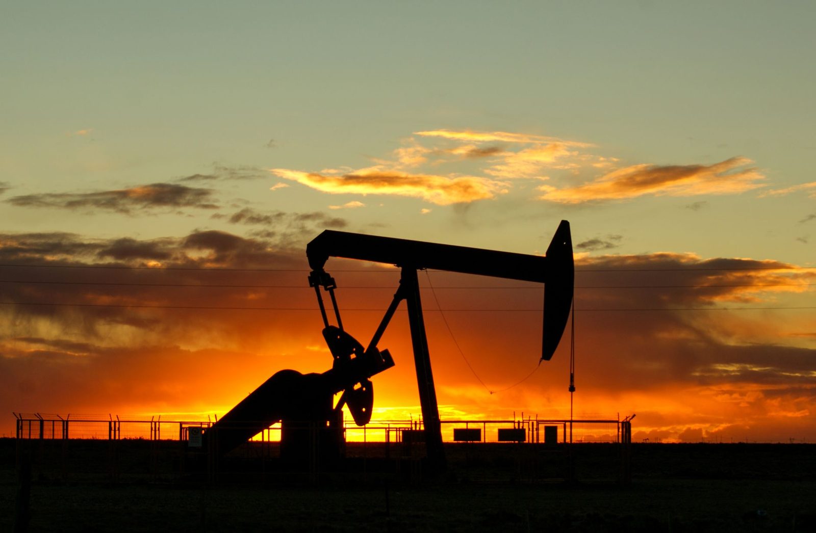 A pumpjack silhouetted against a West Texas sunset