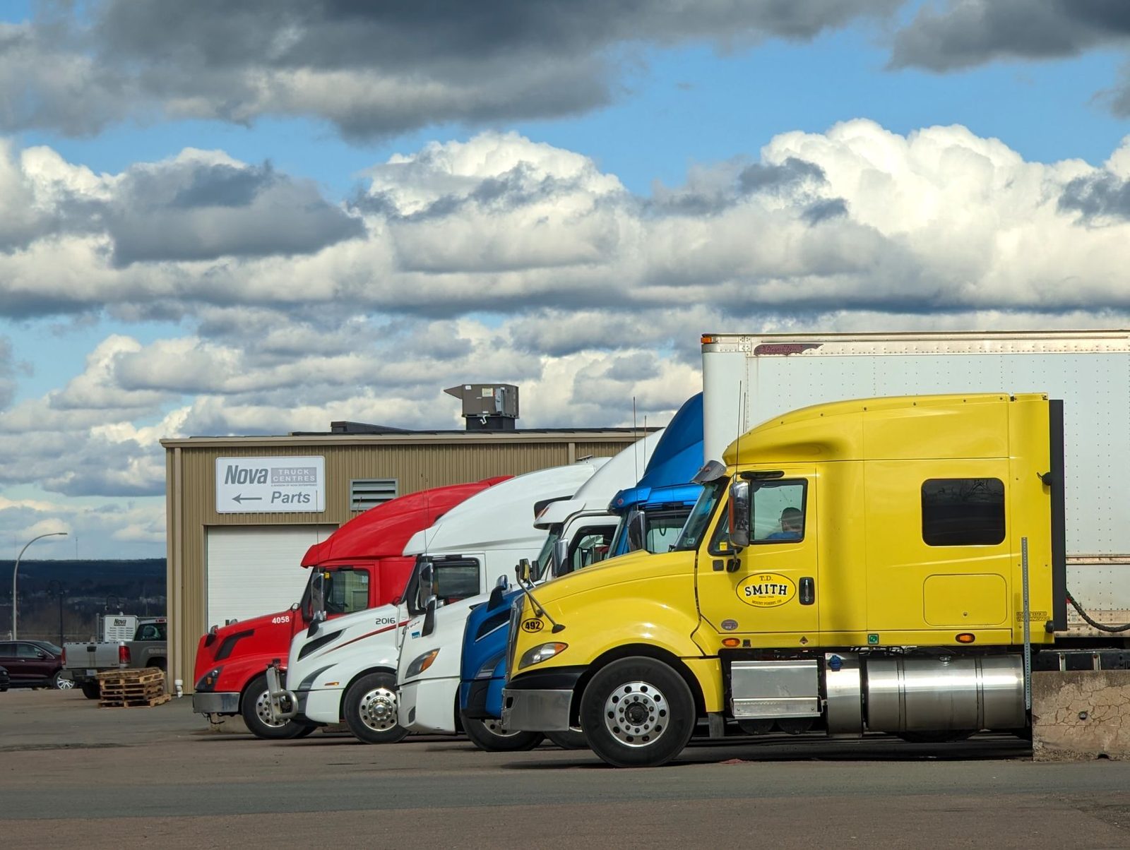 Trucks lined up in a staging yard