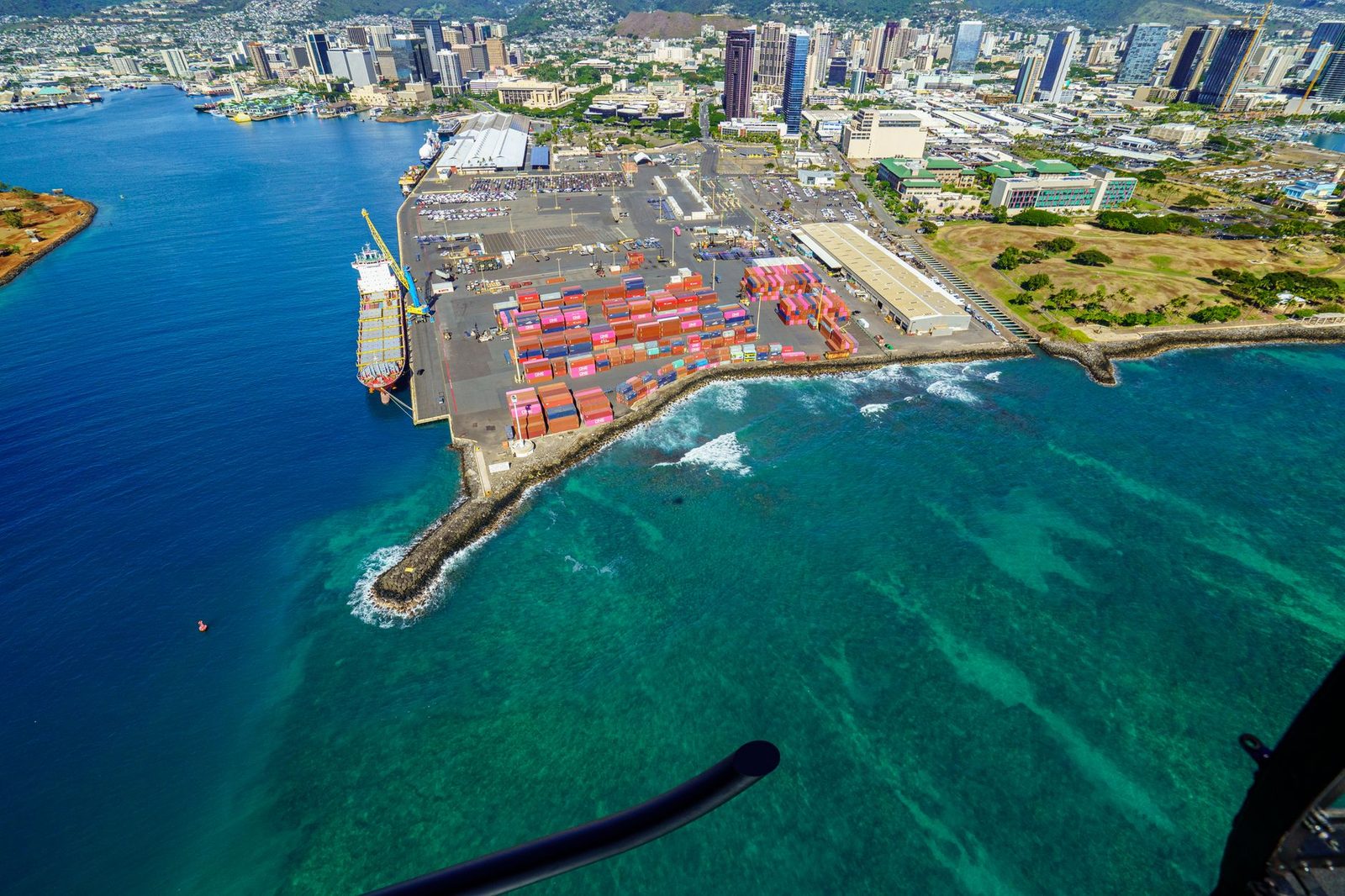 Cargo containers stacked at the Honolulu Harbor piers