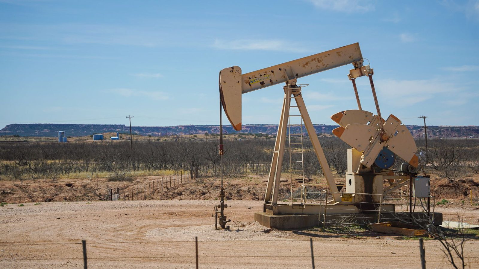 Pumpjacks on flat desert scrubland in the Permian Basin