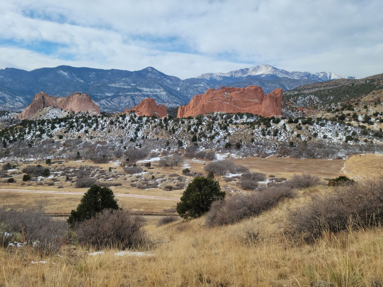 Pikes Peak rising behind the red rocks of Garden of the Gods in Colorado Springs