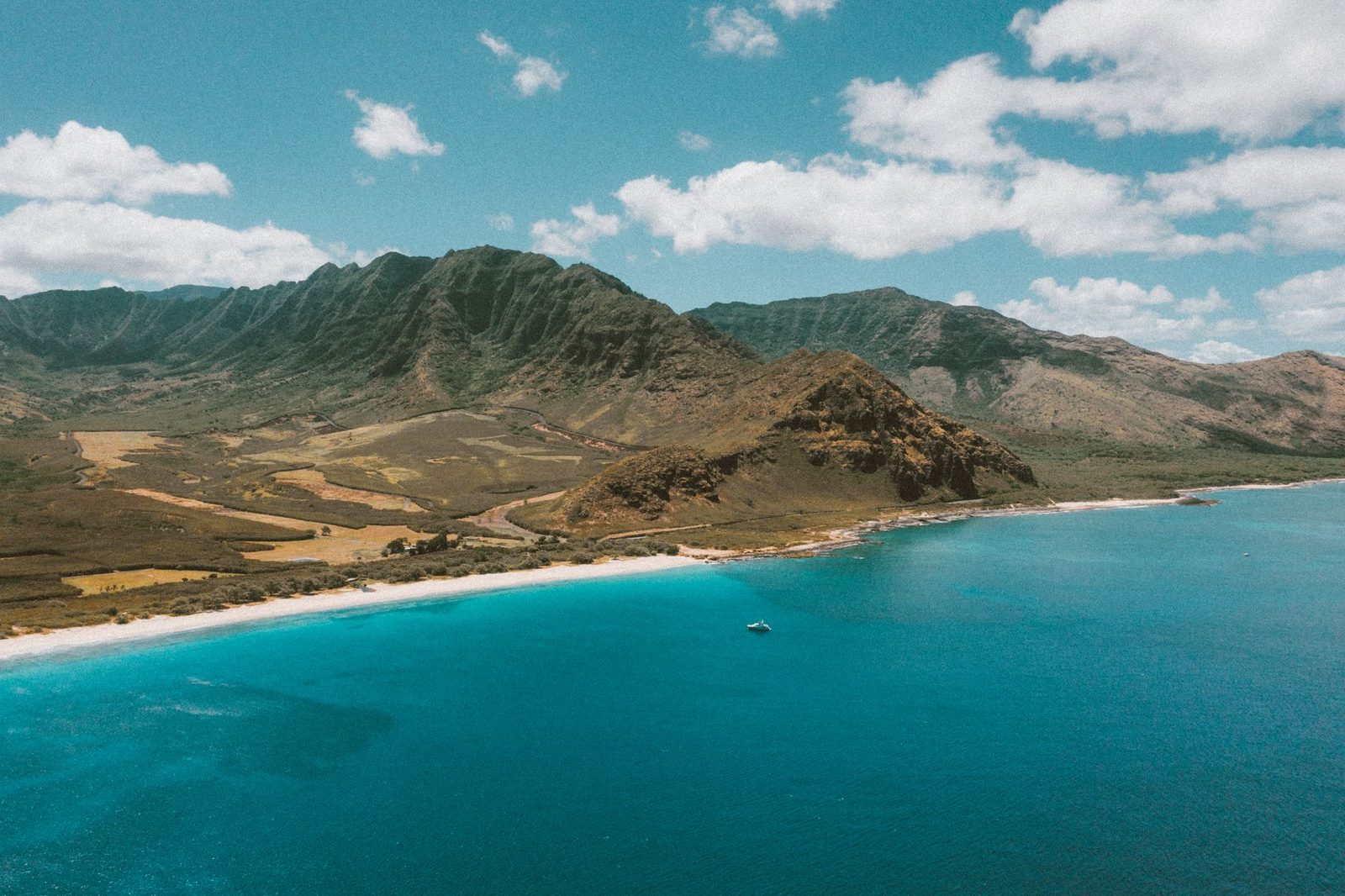 The brown Waianae Range dropping to the leeward coast of Oahu