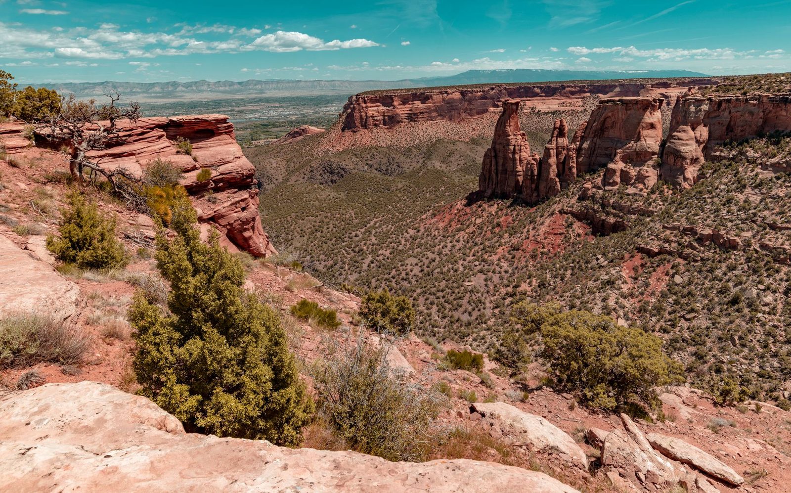 The red rock cliffs of Colorado National Monument above the Grand Valley